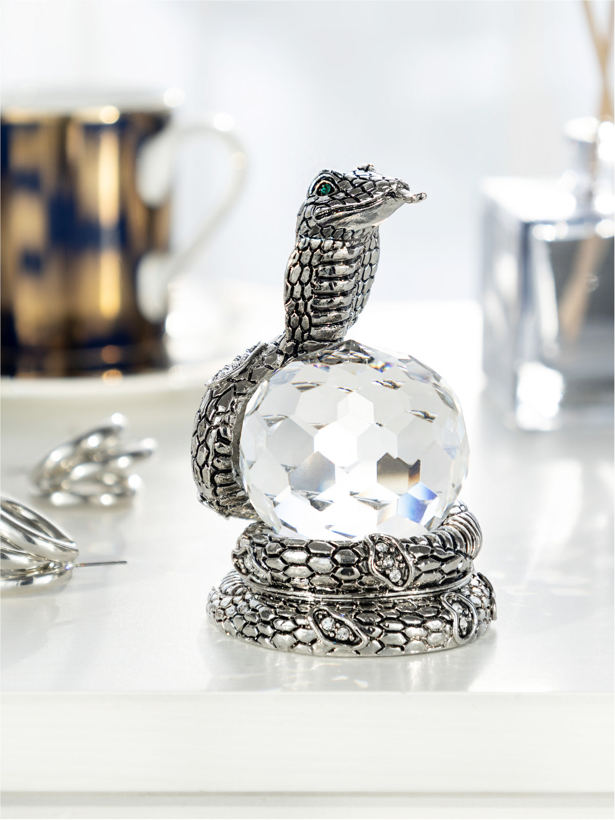 Keren Kopal Snake Holding Crystal