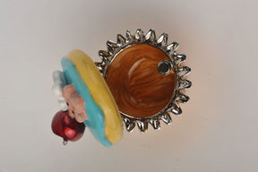 Keren Kopal Blue and Yellow Frosting Cupcake