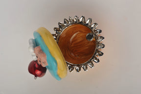 Keren Kopal Blue and Yellow Frosting Cupcake