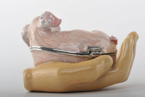 Keren Kopal Zodiac Pig Laying on Hand